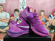 Angled display of two purple Nike basketball sneakers showing the side Swoosh, heel graphics and purple outsoles.