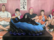 Side profile of a blue and black Nike Air Max sneaker with visible side branding and a segmented outsole.