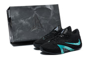 Black and green basketball shoes displayed beside a branded shoe box