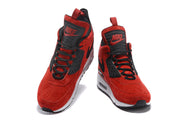 Front views of red and black Nike Air Max 90 high-top sneakers with lace-up closures.