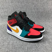 Three-quarter view showing the red perforated toe panels, black overlays and teal eyelet panels.