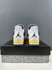 Rear view of the pair showing heel logos, white uppers, yellow midsole sections, and gray outsole edges.
