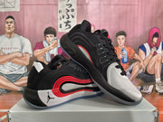 Angled view of black, red, and white Jordan basketball sneakers with lace-up fastening and contrasting side accents.