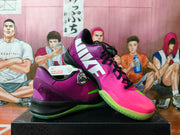 Angled view showing pink and purple Nike basketball shoes with Kobe-themed details and neon green accents.