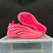 Pair of vivid pink basketball-style sneakers shown from the side and outsole.