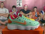 Side view of the mint green sneaker showing orange Swoosh branding, circular accents, red collar lining, and a white textured sole.
