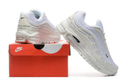 White Nike sneakers displayed with a red Nike shoebox.