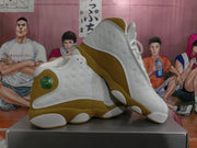 Angled view of the white and wheat high-top sneakers with segmented soles and heel details.