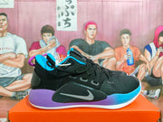 Side view of a black Nike basketball shoe with blue and purple accents, silver-tone Swoosh, and white outsole