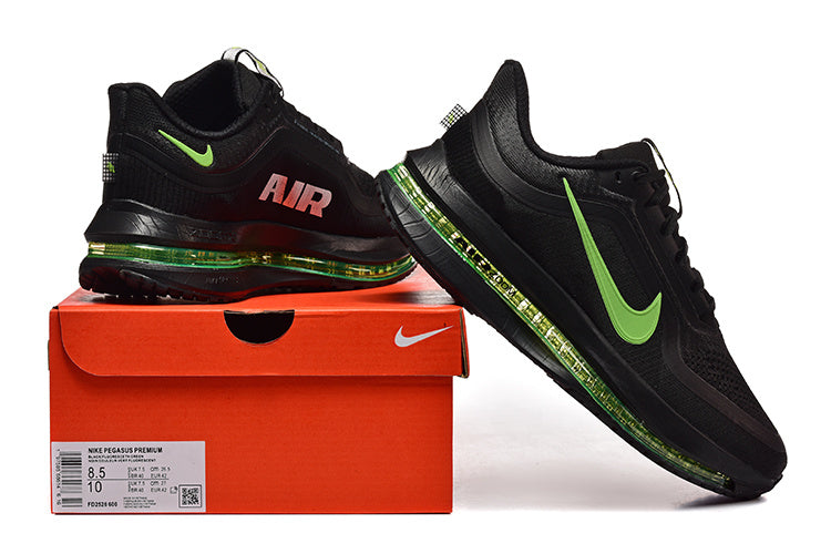 Black Nike Pegasus Premium running shoes with green accents displayed beside a shoe box
