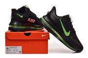 Black Nike Pegasus Premium running shoes with green accents displayed beside a shoe box
